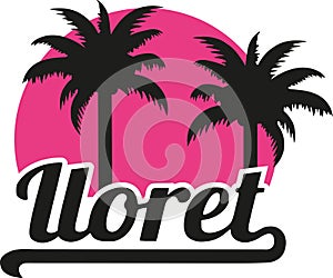 Lloret de Mar with pink sun and palms photo