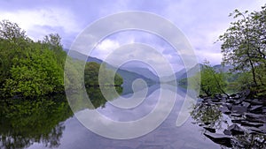 Llyn Padarn at dawn with an foreboding overcast sky