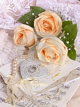 Wedding image with tea roses and pearl necklace