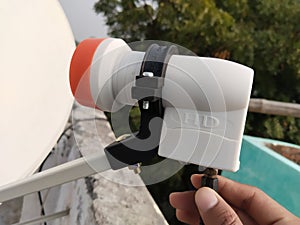 LNB receiver or satellite dish antenna, low noise band. Reparing or maintanence by skillful worker.
