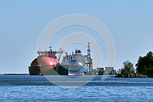 LNG tanker and carrier as floating LNG storageand import terminal in port. Alternative gas supply, commercial freight photo