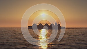 LNG tanker in ocean at sunset