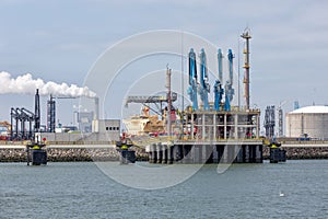 LNG transshipment terminal in harbor Rotterdam, biggest seaport of Europe photo