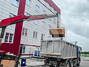 Load garbage from the tank in a specialized car garbage truck. A specialized car