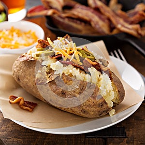 Loaded baked potato with bacon and cheese