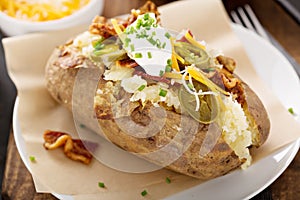 Loaded baked potato with bacon and cheese