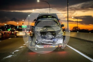 Loaded broken car on a tow truck after crash