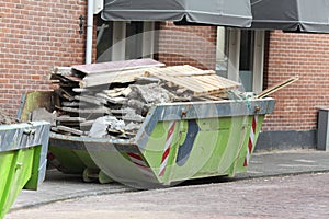 Loaded dumpster near construction site photo