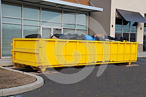 Loaded dumpster near a construction site, home renovation