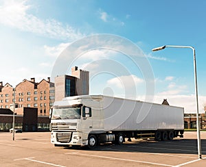 Loaded European truck on motorway. On the road transportation and cargo