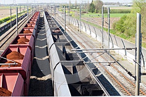 A loaded freight train and a empty freight train