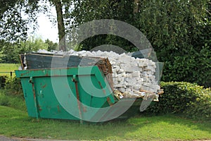 Loaded garbage dumpster