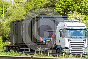 Loaded haulage trailer truck on uk motorway in fast motion