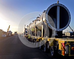 Loaded onto huge multi wheeled heavy haulage trucks are these huge refinery storage vessels.