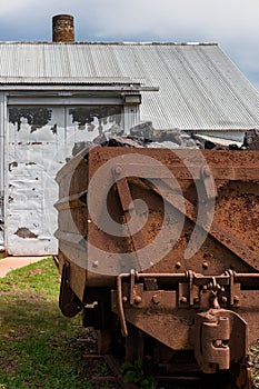 Loaded Ore Cart Near Building at Pioneer Mine in Ely Minnesota photo