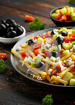 Loaded potato Vegan Fries with tomato, cucumber, olives and feta cheese