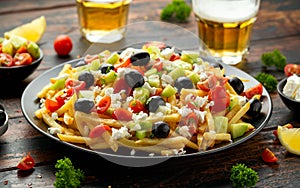 Loaded potato Vegan Fries with tomato, cucumber, olives and feta cheese