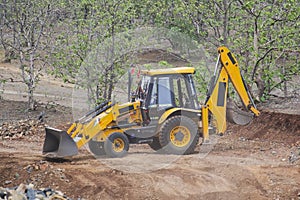 Excavator Loader Backhoe Digger at Road Construction Site