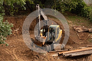 Loader backhoe,excavator digging a trench,Work of excavating machine on building construction site