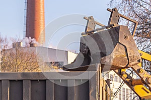 Loader bucket loads into the back of the truck