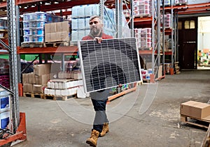 Loader carrying goods to warehouse