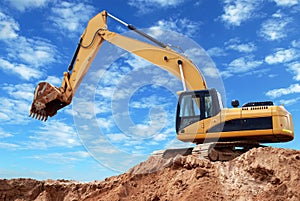 Loader excavator with raised boom