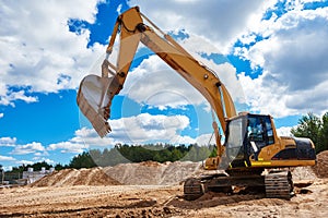 Loader excavator at sandpit during earthmoving works