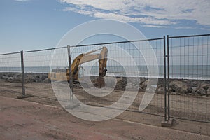 Loader excavator tractor, beach road construction