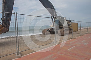 Loader excavator tractor, beach road construction