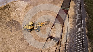 The loader loads the sawdust in the woodworking factory aerial view