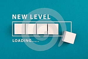 Loading bar with the words new level, education and business concept, progress in a game, step up for a different challenge