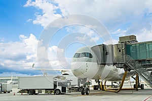 Loading cargo on plane in airport. cargo plane loading for logistic and transport. view through window Passenger terminal