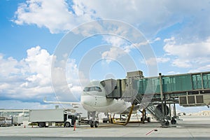 Loading cargo on plane in airport. cargo plane loading for logistic and transport. view through window Passenger terminal