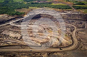 Loading coal into body truck. Mining truck mining machinery,to transport coal. Indonesia coal mining. aerial view.