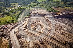 Loading coal into body truck. Mining truck mining machinery,to transport coal. Indonesia coal mining. aerial view.