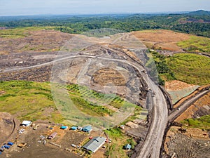 Loading coal into body truck. Mining truck mining machinery,to transport coal. Indonesia coal mining. aerial view.