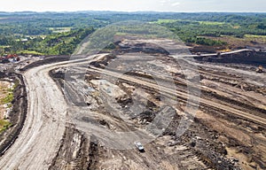 Loading coal into body truck. Mining truck mining machinery,to transport coal. Indonesia coal mining. aerial view.