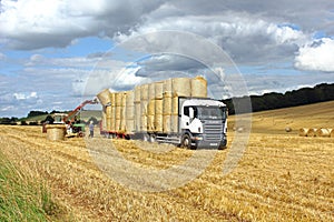 Loading hay bales on a truck