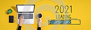 Loading new year 2021 with person using laptop computer