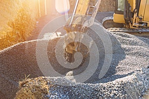 Loading of stone excavator works in gravel pit