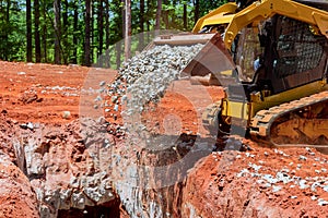 Loading of stone excavator works in gravel pit