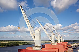 Loading terminal for loading bulk cargo of chemical sulphur to sea bulk carriers using a shore crane. Beaumont, Texas, USA. Ju