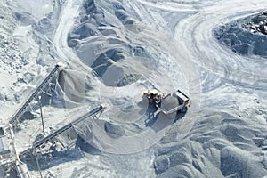 Loading and transportation of stone chips on dump trucks in quar