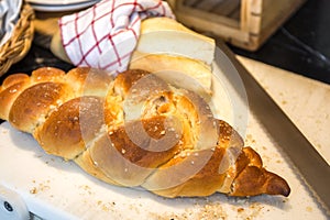 Loaf of Bread on Block with Knife