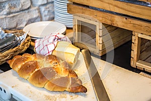 Loaf of Bread on Block with Knife