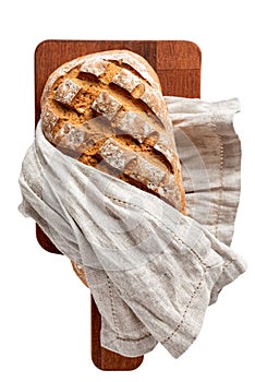 Loaf of bread on cutting board directly above, isolated on a white