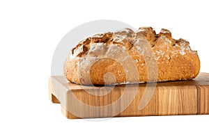 loaf of bread on cutting board, isolated on white
