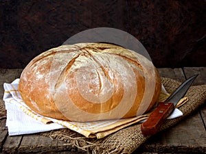 Loaf of bread and knife