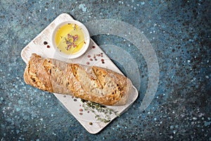 Loaf of bread with olive oil and spices