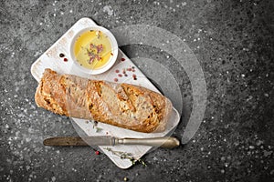 Loaf of bread with olive oil and spices